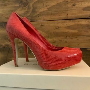 BCBGeneration cherry snake leather platform pumps.